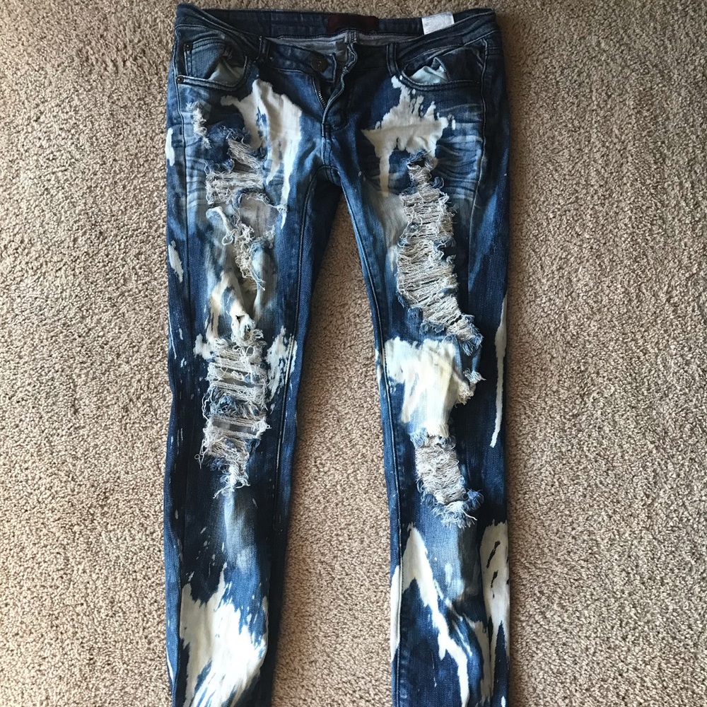 Bleached ripped distressed denim jeans